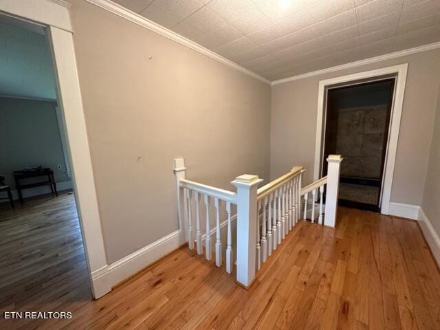 696 Forge Ridge Rd, Harrogate, TN 37752 - hall featuring an upstairs landing, wood finished floors, and crown molding