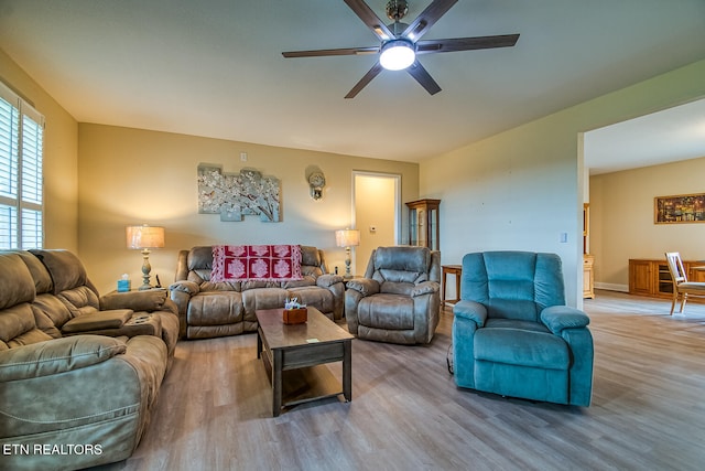 living room with ceiling fan and hardwood / wood-style flooring