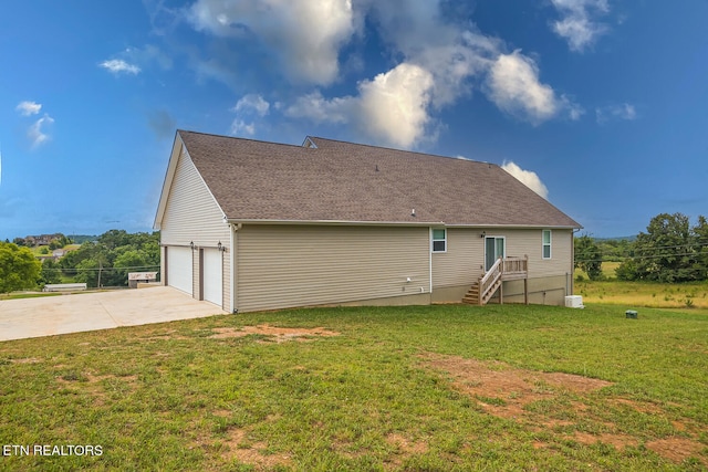 rear view of house featuring a yard