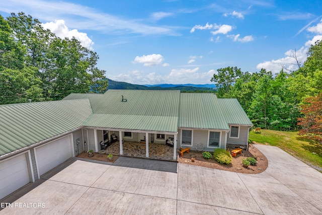 view of front of house featuring a mountain view and a garage