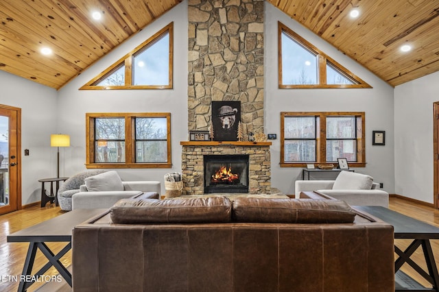 living room with wood ceiling, a fireplace, high vaulted ceiling, and hardwood / wood-style floors