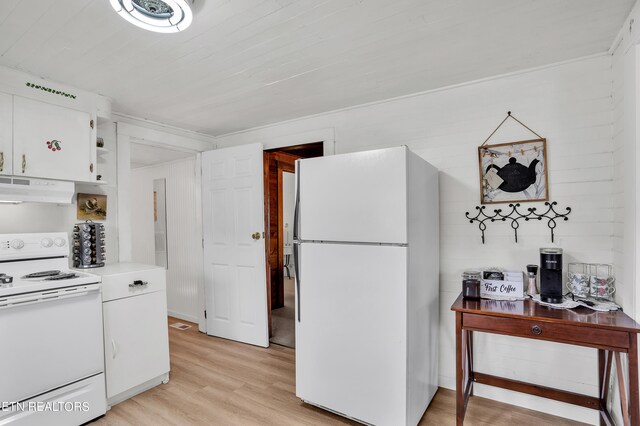 kitchen featuring white appliances, light hardwood / wood-style floors, and white cabinetry