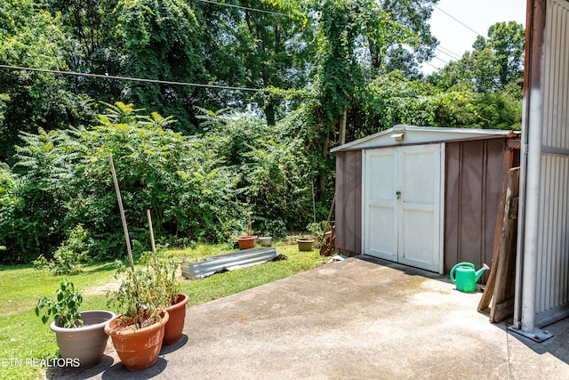 view of patio with a storage unit