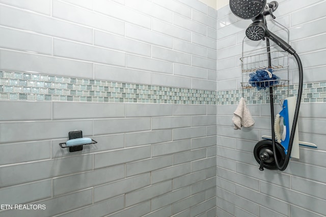 bathroom with tiled shower