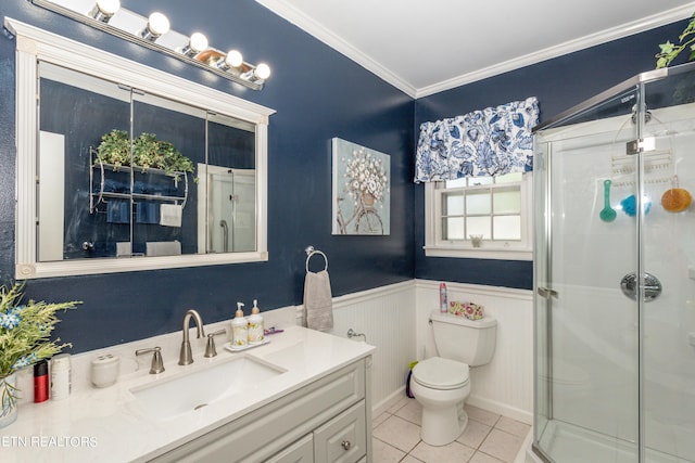 bathroom with walk in shower, tile patterned floors, toilet, vanity, and ornamental molding