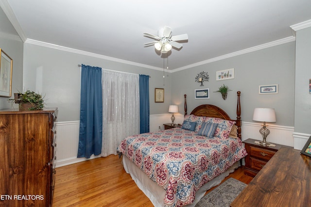 bedroom with ceiling fan, crown molding, and light hardwood / wood-style flooring