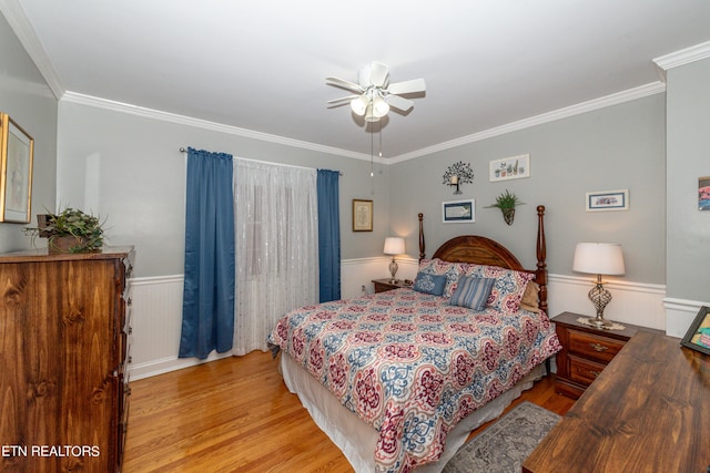 bedroom with ceiling fan, light hardwood / wood-style flooring, and ornamental molding