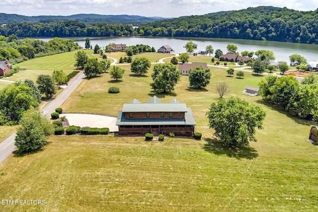 birds eye view of property with a rural view and a water view