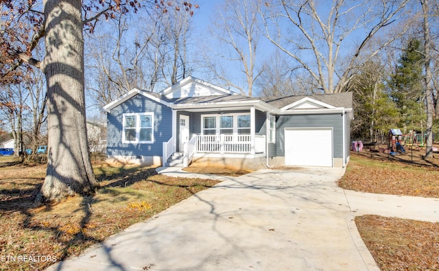 view of front of house featuring a porch and a garage