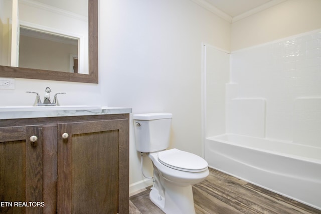 full bathroom with toilet, vanity, shower / washtub combination, hardwood / wood-style floors, and ornamental molding