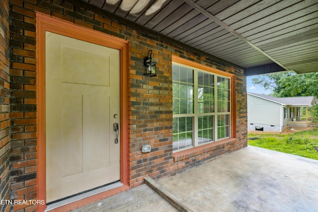 doorway to property featuring a patio area