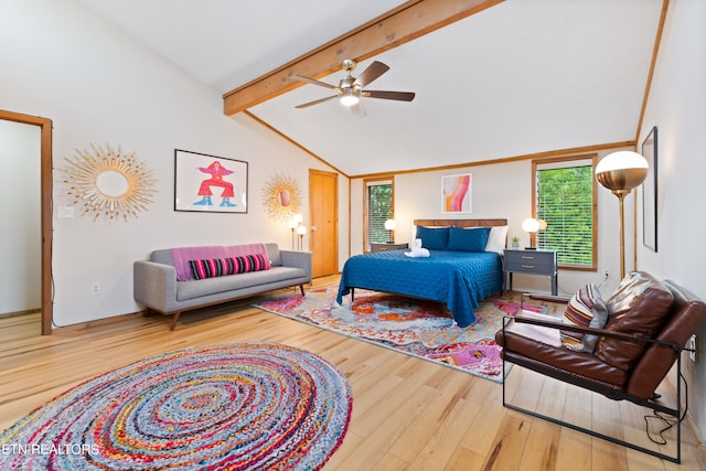 bedroom with multiple windows, wood-type flooring, lofted ceiling with beams, and ceiling fan