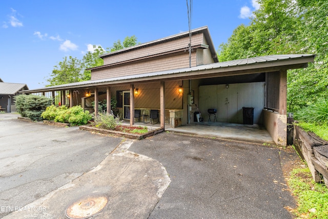 view of front of home featuring a carport