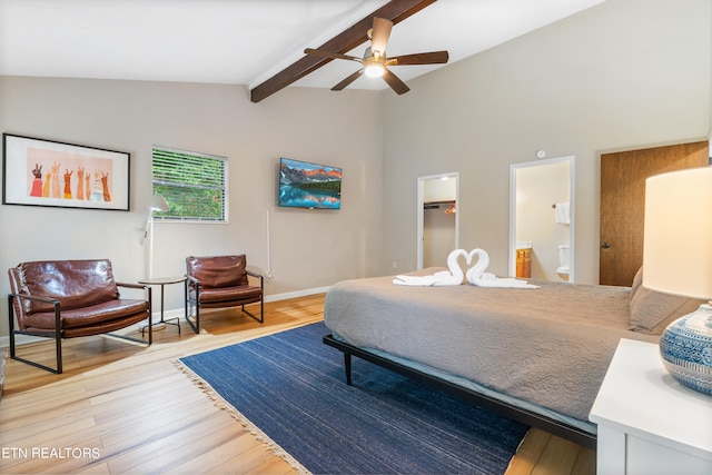 bedroom with a walk in closet, ensuite bath, ceiling fan, light hardwood / wood-style flooring, and a closet