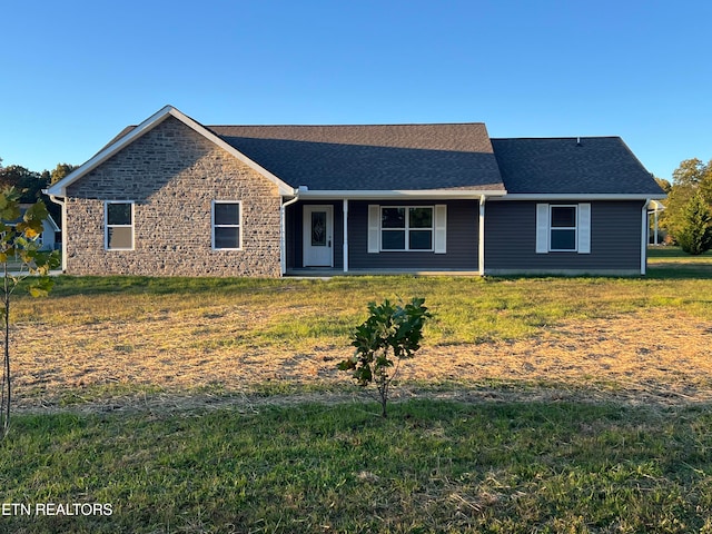 ranch-style house with a front lawn