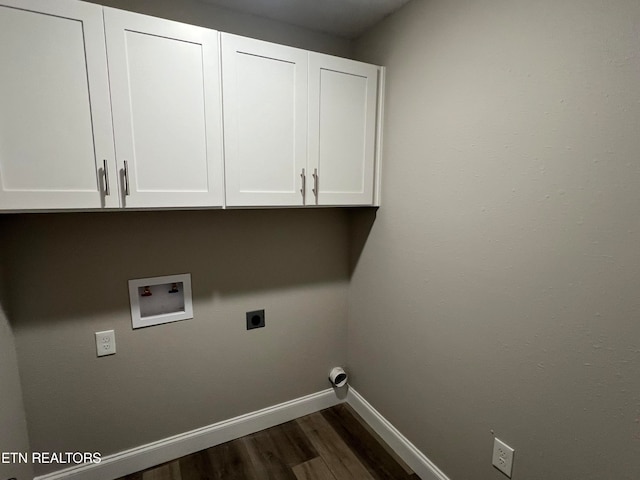 laundry area featuring dark hardwood / wood-style flooring, hookup for an electric dryer, washer hookup, and cabinets