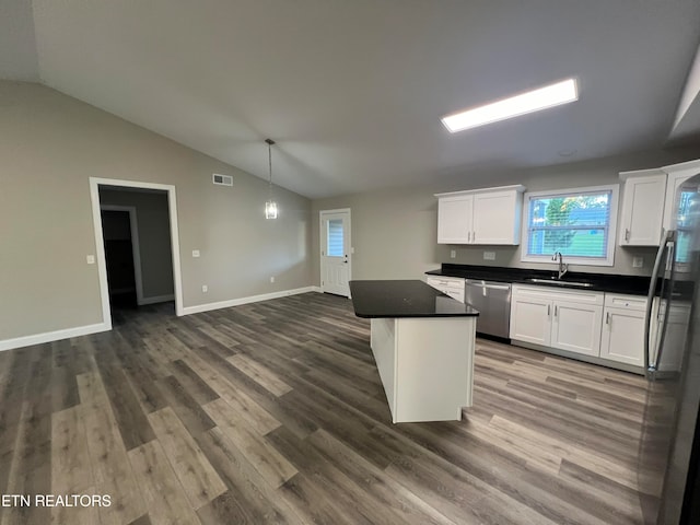 kitchen with white cabinetry, appliances with stainless steel finishes, sink, and dark wood-type flooring