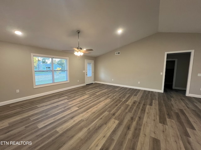 unfurnished living room with dark wood-type flooring, vaulted ceiling, and ceiling fan