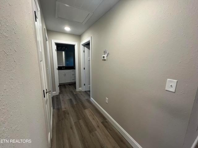 hall with dark wood-type flooring