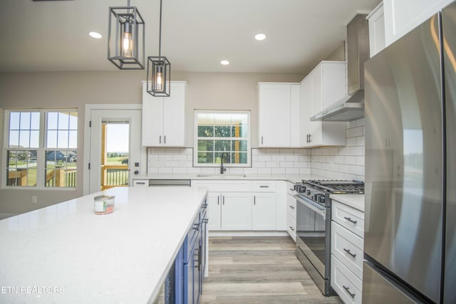 116 Duseth Dr, Sweetwater, TN 37874 - kitchen with appliances with stainless steel finishes, wall chimney exhaust hood, white cabinets, recessed lighting, and backsplash