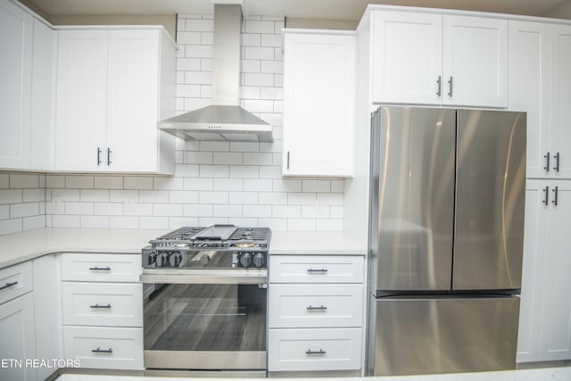 116 Duseth Dr, Sweetwater, TN 37874 - kitchen with stainless steel appliances, wall chimney range hood, light countertops, decorative backsplash, and white cabinetry