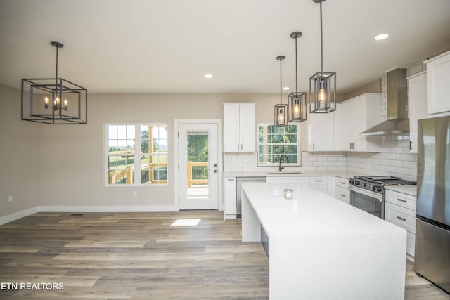 116 Duseth Dr, Sweetwater, TN 37874 - kitchen with wall chimney exhaust hood, stainless steel appliances, healthy amount of natural light, light countertops, and recessed lighting