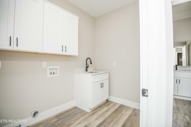 116 Duseth Dr, Sweetwater, TN 37874 - washroom featuring light wood-type flooring, cabinet space, hookup for a washing machine, and hookup for an electric dryer