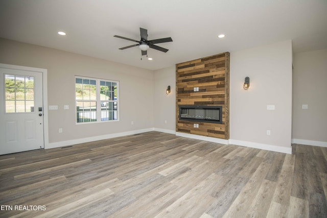 116 Duseth Dr, Sweetwater, TN 37874 - unfurnished living room with a large fireplace, a ceiling fan, recessed lighting, and wood finished floors