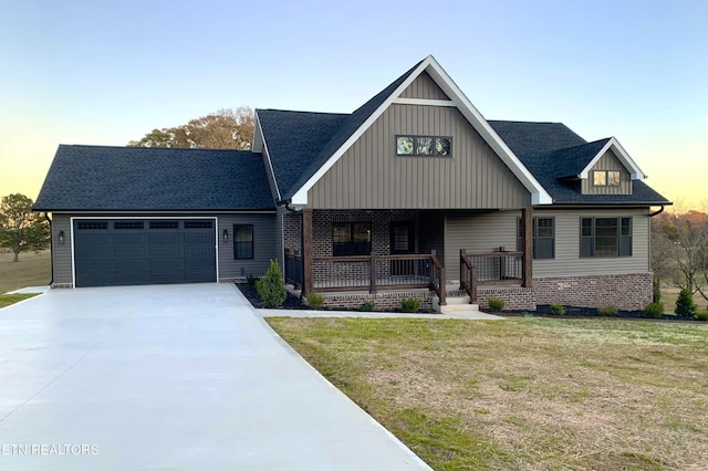 116 Duseth Dr, Sweetwater, TN 37874 - view of front of home with a garage, concrete driveway, covered porch, a yard, and board and batten siding