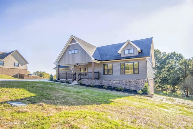 116 Duseth Dr, Sweetwater, TN 37874 - view of front of property featuring ceiling fan, a front lawn, a shingled roof, and board and batten siding