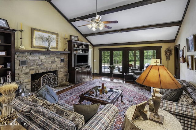 living room featuring a fireplace, lofted ceiling with beams, baseboards, and wood finished floors