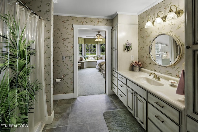 full bathroom with wallpapered walls, baseboards, ornamental molding, tile patterned floors, and vanity