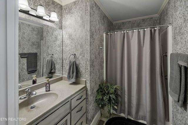 bathroom with wallpapered walls, a shower with curtain, vanity, and ornamental molding