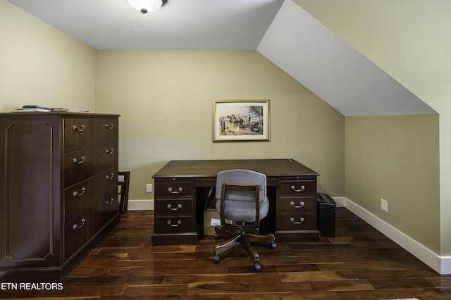 office area featuring baseboards, dark wood-style flooring, and vaulted ceiling