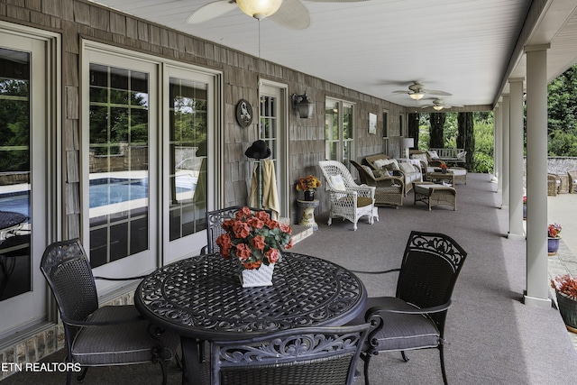 view of patio with outdoor lounge area and ceiling fan