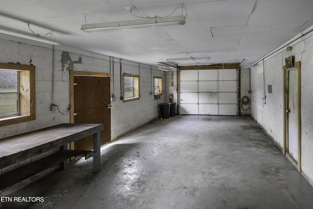 garage featuring concrete block wall