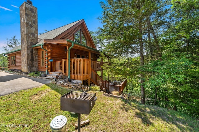 exterior space featuring a front lawn and a porch