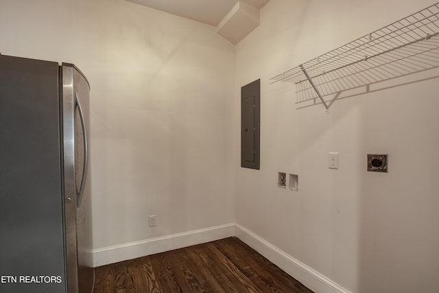 clothes washing area featuring washer hookup, electric panel, dark hardwood / wood-style flooring, and hookup for an electric dryer