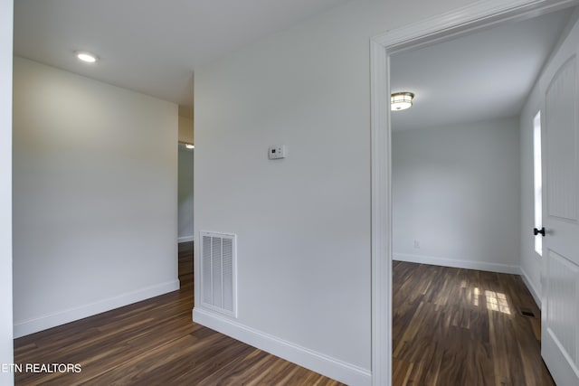 hall with dark wood-type flooring