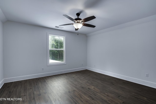 unfurnished room featuring ceiling fan and dark hardwood / wood-style flooring