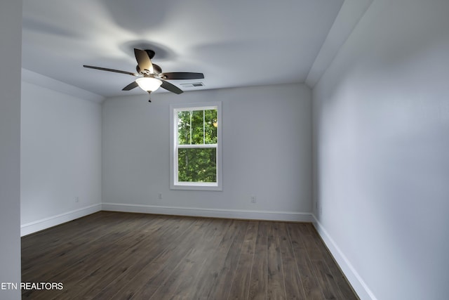 spare room with ceiling fan and dark hardwood / wood-style flooring