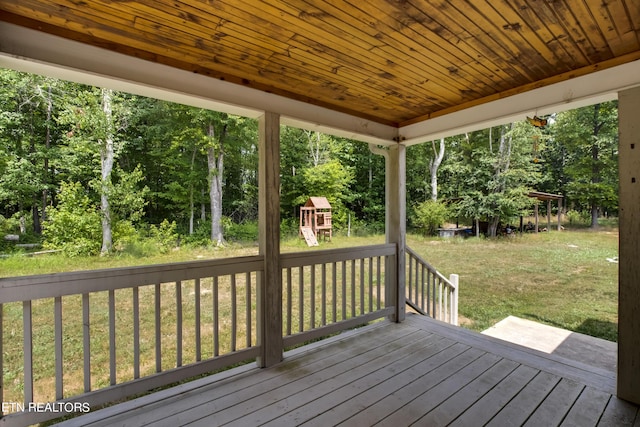 deck featuring a yard and a playground