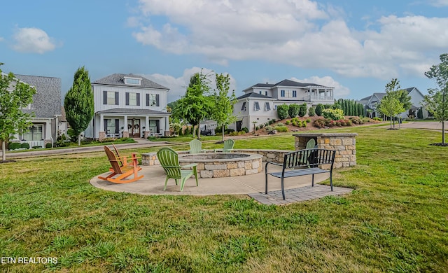 surrounding community featuring a patio area, a yard, and a fire pit