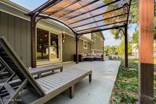 view of patio with a pergola and an outdoor living space