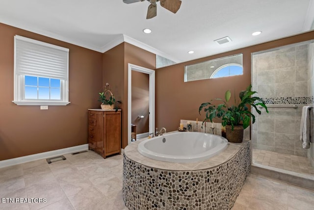 bathroom featuring ceiling fan, a wealth of natural light, ornamental molding, and tiled tub