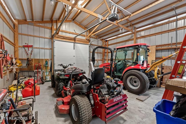 garage with a workshop area and a garage door opener