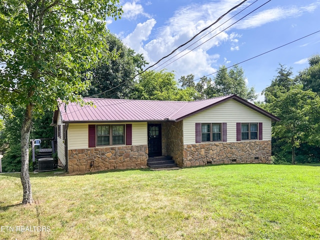 single story home featuring a front yard and central AC unit