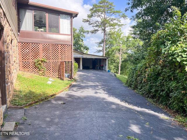 view of property exterior featuring a carport