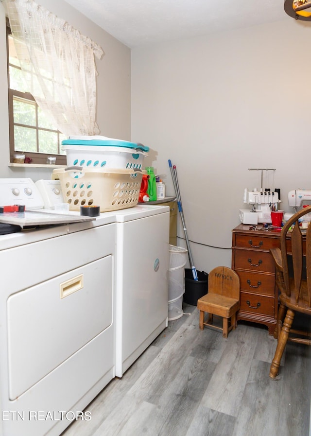 laundry room featuring light hardwood / wood-style floors and independent washer and dryer