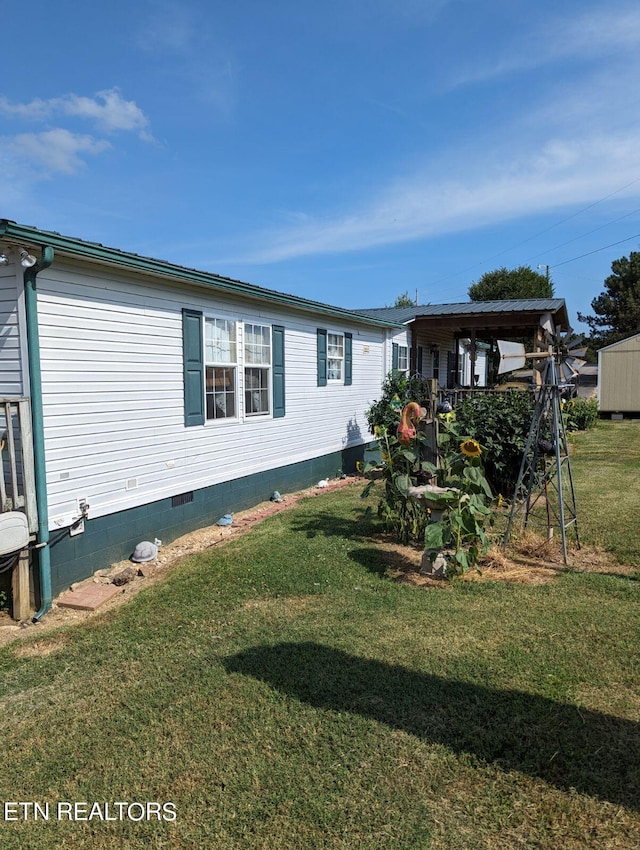 view of home's exterior with crawl space and a lawn